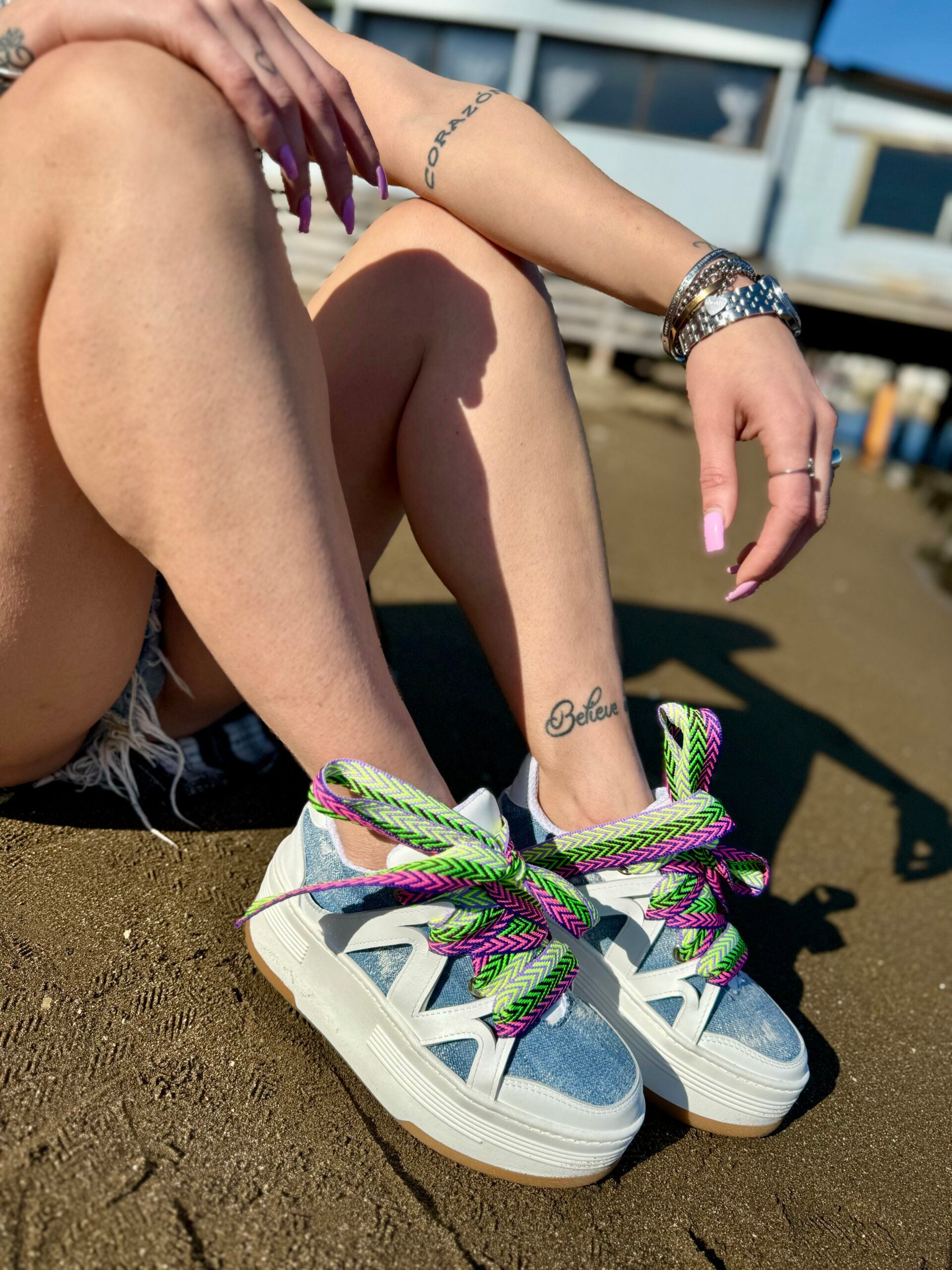 Wolf5 white leather rip jeans with multicolor laces.